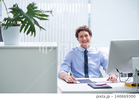 Businessman, office and portrait with corporate technology and desk, happy and confident male person sitting. Workspace, digital search and administrator with smile, browse internet on business pc Businessman, office and portrait with corporate technology and desk, happy and confident male person sitting. Workspace, digital search and administrator with smile, browse internet on business pc 140669300