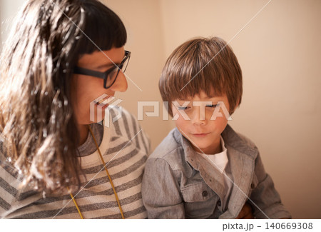 Home, son and mother with smile, happiness and bonding together with weekend break and single parent. Conversation, mama or boy with discussion and funny with childhood and cheerful with kid or relax 140669308