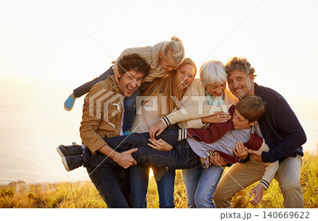 Grandparents, parents and kids fun portrait in nature, spring in countryside. Exercise, excited with generations playing with child, happy in field on vacation with family together in calm outdoors Grandparents, parents and kids fun portrait in nature, spring in countryside. Exercise, excited with generations playing with child, happy in field on vacation with family together in calm outdoors 140669622