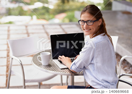Businesswoman, portrait and laptop typing at cafe, restaurant or coffee shop for communication, internet and technology. Female person, professional or entrepreneur with computer for startup business 140669668