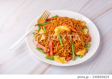 egg and Ham Fried Noodles - Classic Chinese Stir Fried Noodle Dish egg and Ham Fried Noodles - Classic Chinese Stir Fried Noodle Dish 140669829