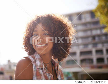 Portrait, smile and black woman in city for fun, sunshine and weekend break in Amsterdam. Afro, confidence and face of female person in downtown for happiness, explore and urban lifestyle outdoor 140669944
