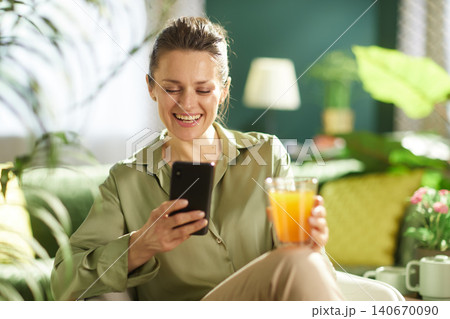 Cheerful Woman Having a Healthy Snack Break at Home Cheerful Woman Having a Healthy Snack Break at Home 140670090