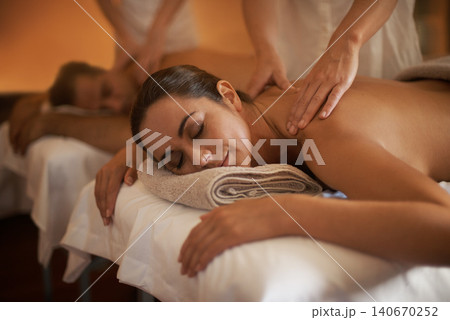 Hands, back massage or calm couple in spa to relax on bed for luxury pamper treatment together in hotel. Beauty, sleep or zen woman with man at resort or salon for natural healing benefits or body Hands, back massage or calm couple in spa to relax on bed for luxury pamper treatment together in hotel. Beauty, sleep or zen woman with man at resort or salon for natural healing benefits or body 140670252