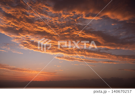 Panorama of beautiful sunset over ocean and sailboats Panorama of beautiful sunset over ocean and sailboats 140670257