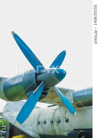 Close view of a vintage aircraft propeller at a museum in the afternoon light showing details of blue blades against a clear sky Close view of a vintage aircraft propeller at a museum in the afternoon light showing details of blue blades against a clear sky 140670550