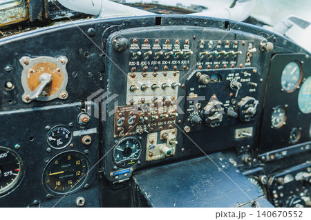 Cockpit of an old airplane with various controls and gauges showing the interior of a vintage aircraft 140670552