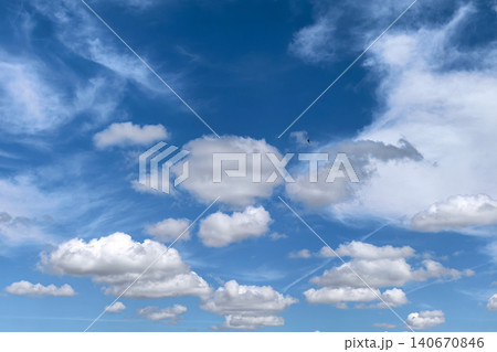 Cloudscape With Swallow Flying Across Blue Sky 140670846