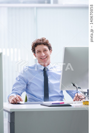 Man, office and portrait with pc and desk, happy and confident corporate male person sitting in workspace. Technology, digital search administrator and smile, browse internet on business computer 140670858