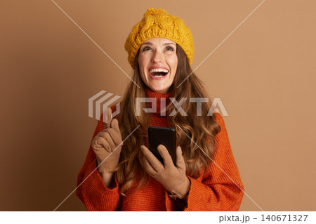Cheerful Woman with a Bright Idea and Smartphone Cheerful Woman with a Bright Idea and Smartphone 140671327