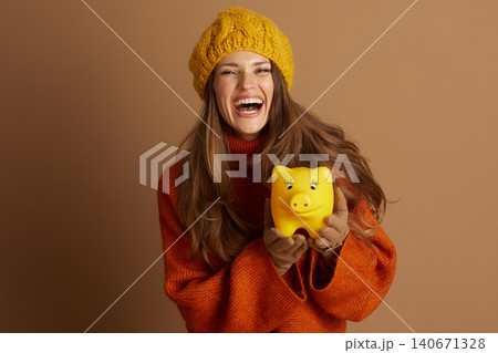 Cheerful Woman Celebrating Financial Savings 140671328