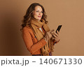 Middle-Aged Woman Engaging with Smartphone Display Middle-Aged Woman Engaging with Smartphone Display 140671330