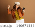 Engaged Woman with Smartphone and Pursed Lips Engaged Woman with Smartphone and Pursed Lips 140671334