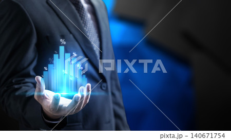 Businessman holding a glowing virtual blue bar chart with percentage symbols representing financial growth, interest rates, investment returns, and economic data analysis Businessman holding a glowing virtual blue bar chart with percentage symbols representing financial growth, interest rates, investment returns, and economic data analysis 140671754