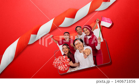 Group of happy young Indonesians in red and white attire celebrating Independence Day, framed inside a smartphone mockup against a solid red background. Hari Kemerdekaan Dirgahayu Indonesia Group of happy young Indonesians in red and white attire celebrating Independence Day, framed inside a smartphone mockup against a solid red background. Hari Kemerdekaan Dirgahayu Indonesia 140671856
