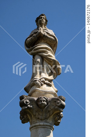 Statue of Virgin Mary on a column in front of the Church of St. Catherine of Alexandria in Krapina, Croatia 140672176