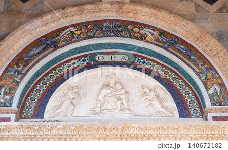Madonna with the Child, by Andrea Gurdi lunette over the portal of Cathedral in Pisa, Italy. Unesco World Heritage Site Madonna with the Child, by Andrea Gurdi lunette over the portal of Cathedral in Pisa, Italy. Unesco World Heritage Site 140672182