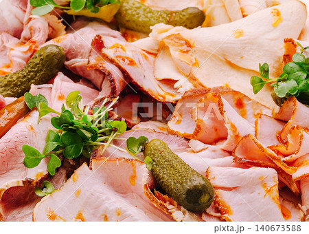 Deli charcuterie platter with sliced meats and pickles Deli charcuterie platter with sliced meats and pickles 140673588