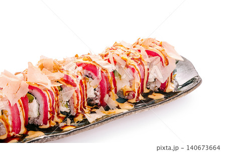 Tuna sushi rolls with bonito flakes and sauce Tuna sushi rolls with bonito flakes and sauce 140673664
