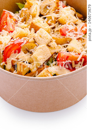 Caesar salad with croutons, cheese, and chicken in takeaway bowl Caesar salad with croutons, cheese, and chicken in takeaway bowl 140673679