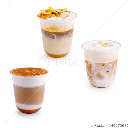 Iced coffee beverages with banana, caramel, and cinnamon topping Iced coffee beverages with banana, caramel, and cinnamon topping 140673685
