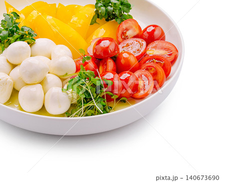 Fresh caprese salad with mozzarella, tomatoes, pepper, greens 140673690
