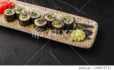 Cucumber kappa maki sushi rolls with wasabi and ginger 140673711