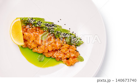 Salmon tartare with avocado lemon and sesame Salmon tartare with avocado lemon and sesame 140673740