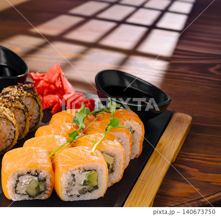 Sushi rolls with salmon, cucumber, and pickled ginger Sushi rolls with salmon, cucumber, and pickled ginger 140673750