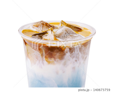 Layered iced butterfly pea latte espresso drink Layered iced butterfly pea latte espresso drink 140673759
