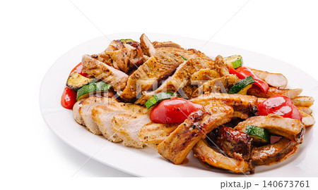 Grilled chicken and vegetables plate isolated on white 140673761