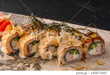 Sushi rolls with salmon, shrimp, bonito flakes, and nori Sushi rolls with salmon, shrimp, bonito flakes, and nori 140673807
