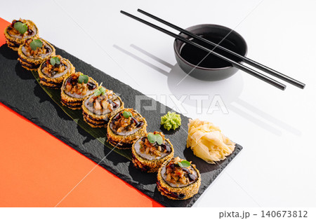 Fried sushi rolls set with soy sauce and chopsticks Fried sushi rolls set with soy sauce and chopsticks 140673812