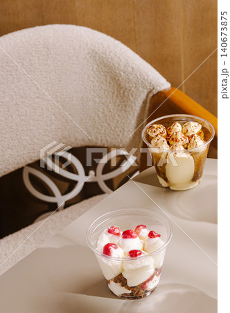 Tiramisu and berry desserts in plastic cups 140673875