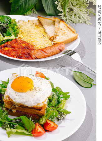 American breakfast plates with croque madame and sausage 140673920