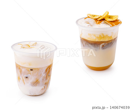 Iced coffee lattes with banana chips and foam Iced coffee lattes with banana chips and foam 140674039