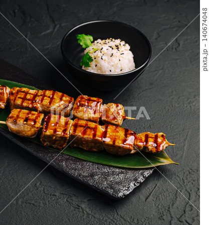 Chicken yakitori skewers with teriyaki sauce and rice 140674048