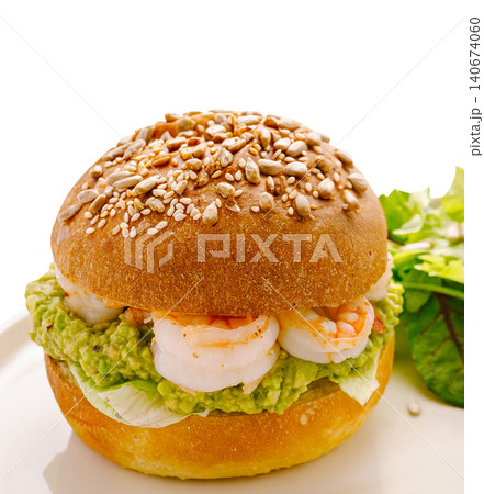 Shrimp and avocado burger with lettuce and seeds Shrimp and avocado burger with lettuce and seeds 140674060