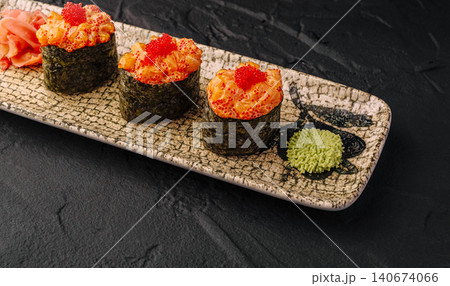 Gunkan sushi with salmon and red caviar on plate 140674066