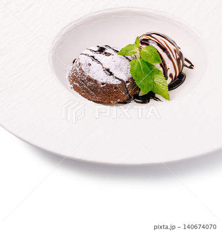 Chocolate lava cake serving with ice cream and mint Chocolate lava cake serving with ice cream and mint 140674070