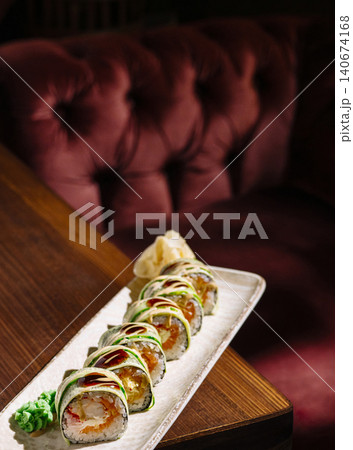 Fresh sushi rolls served on wooden table Fresh sushi rolls served on wooden table 140674168