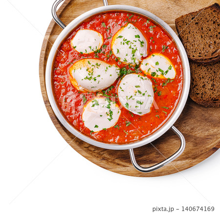 Shakshuka eggs with tomato sauce and herbs Shakshuka eggs with tomato sauce and herbs 140674169