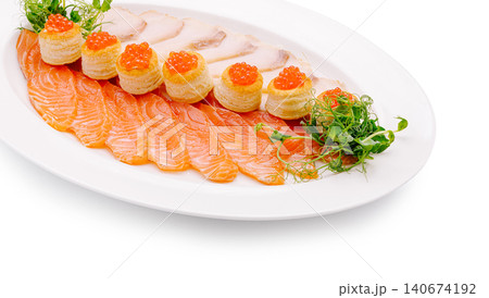 Salmon platter with red caviar vol-au-vents and white fish slices Salmon platter with red caviar vol-au-vents and white fish slices 140674192