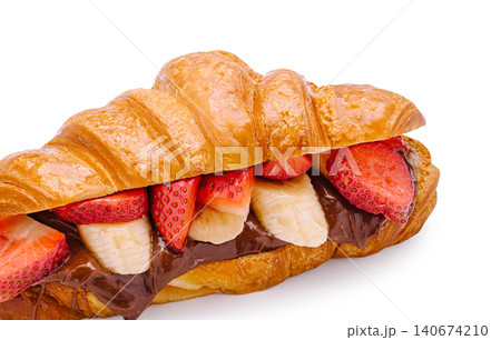 Croissant filled with chocolate, strawberries, and banana Croissant filled with chocolate, strawberries, and banana 140674210
