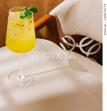 Passion fruit mint spritz cocktail refreshing summer drink 140674274