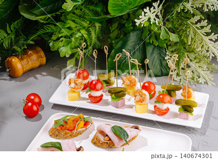 Antipasto platter with assorted canapes and finger food Antipasto platter with assorted canapes and finger food 140674301