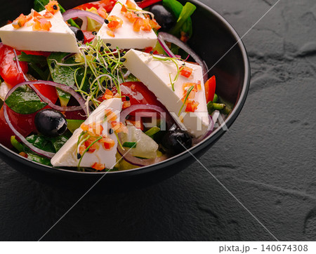 Greek salad with feta cheese and fresh vegetables 140674308