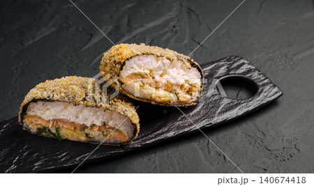 Fried salmon sushi burger with rice and breadcrumbs 140674418