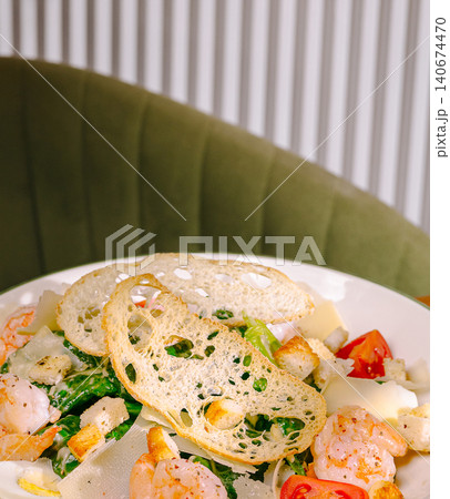 Shrimp caesar salad with croutons and fresh tomatoes Shrimp caesar salad with croutons and fresh tomatoes 140674470
