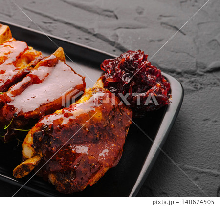 Glazed pork ribs with sweet onion jam 140674505